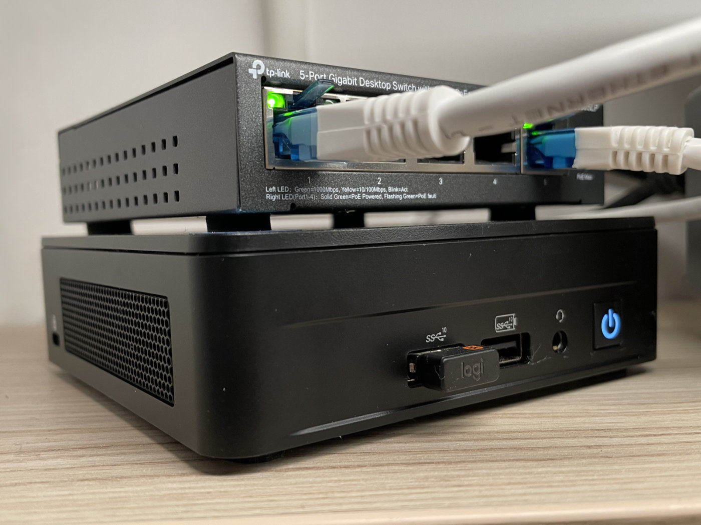 A shot showing the NUC (bottom) and a PoE switch (top).